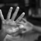 Boy showing STOP gesture with his hand. Concept of domestic violence and child abuse. Copy space